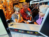 Former DJ's Gloria Clark, right, and Chris Connors, center, compile a list of former station DJ's with station director, Jennifer Mulcare-Sullivan before the station goes off the air.  The University of Massachusetts Dartmouth radio station, WUMD, stopped broadcasting over the airwaves after 42 continuous years.   It will now continue to broadcast strictly over the internet at www.umd.rocks   [ PETER PEREIRA/THE STANDARD-TIMES/SCMG ]